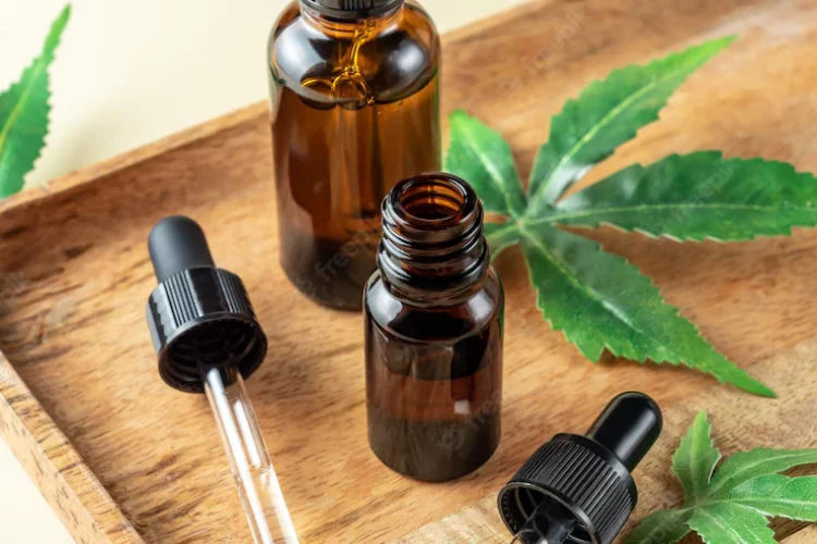 glass-bottles-with-herbal-cbd-oil-tincture-hemp-leaf-pastel-beige-background-cosmetics-cbd-oil-essential-natural-oils-face-body_105596-4222