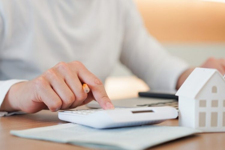 man-hand-press-calculator-check-summary-expense-home-loan-mortgage-refinance-plan_42708-716